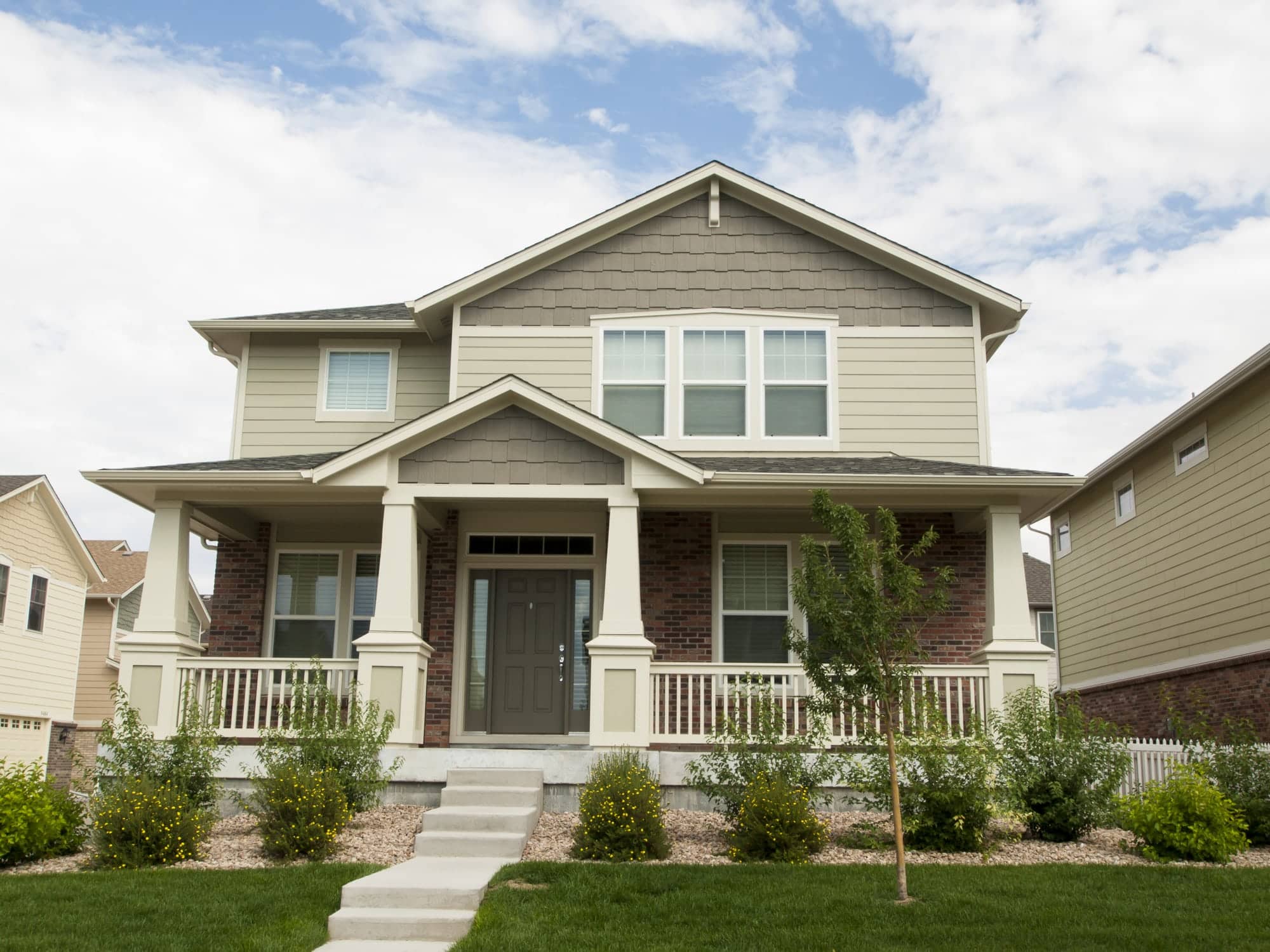 Beige home with driveway. Text says "How To Make Money Renting Out Your Driveway" which is for a Neighbor Review.